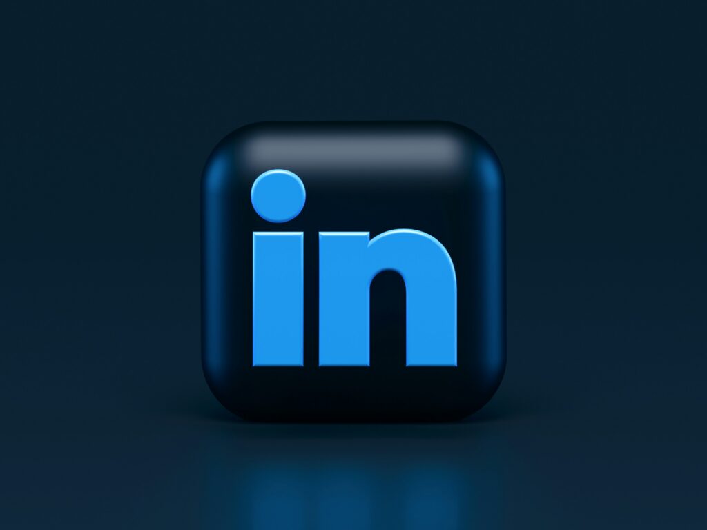 A 3D version of the LinkedIn "LI" logo on a dark background.