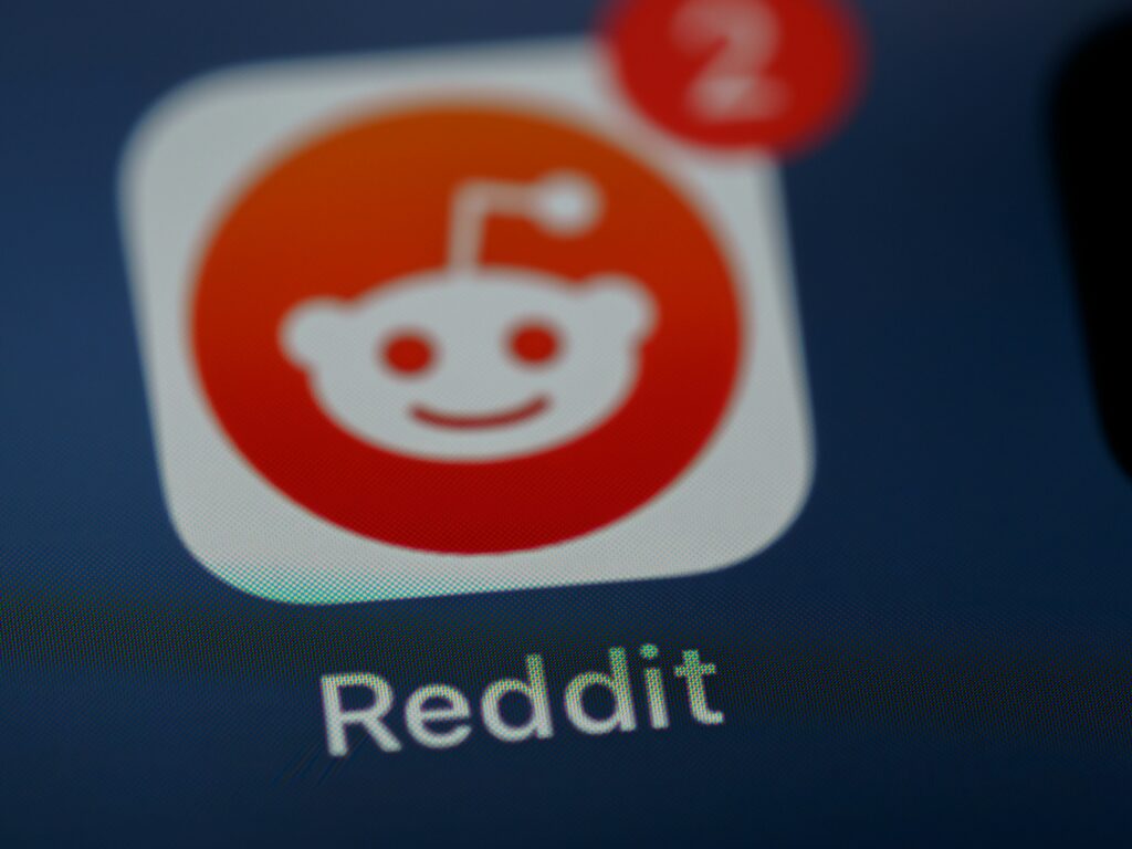 A picture of the Reddit app icon on a phone screen.