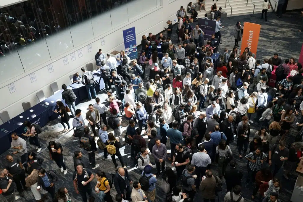 Looking down on a crowded trade show floor.